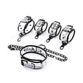 Clear PVC bondage set collar handcuffs and ankle cuffs laid out - Dominitoy 252401233T