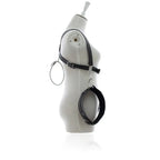 Adjustable leather thigh wrist restraints harness shown on mannequin side view, featuring professional-grade design.
