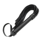 Dominitoy black flogger angled view showing studded handle and wrist loop

