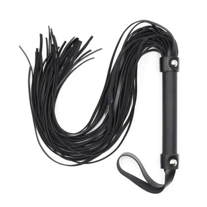 Dominitoy black PU leather flogger with studded handle laid on white background
