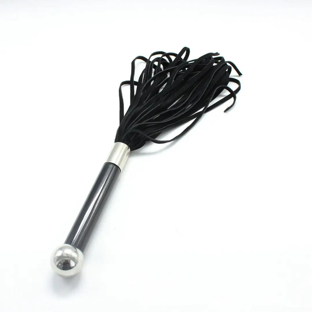 Dominitoy black suede flogger angled view on white background
