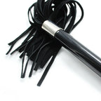 Close-up of Dominitoy suede flogger metal ball handle and suede tails
