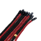 Close-up of Dominitoy braided rope flogger black tips