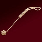 Dominitoy natural rope ball flogger laid out on white background