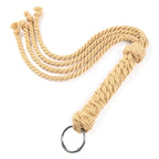 Dominitoy yellow rope braided handle flogger with detachable metal ring on white background