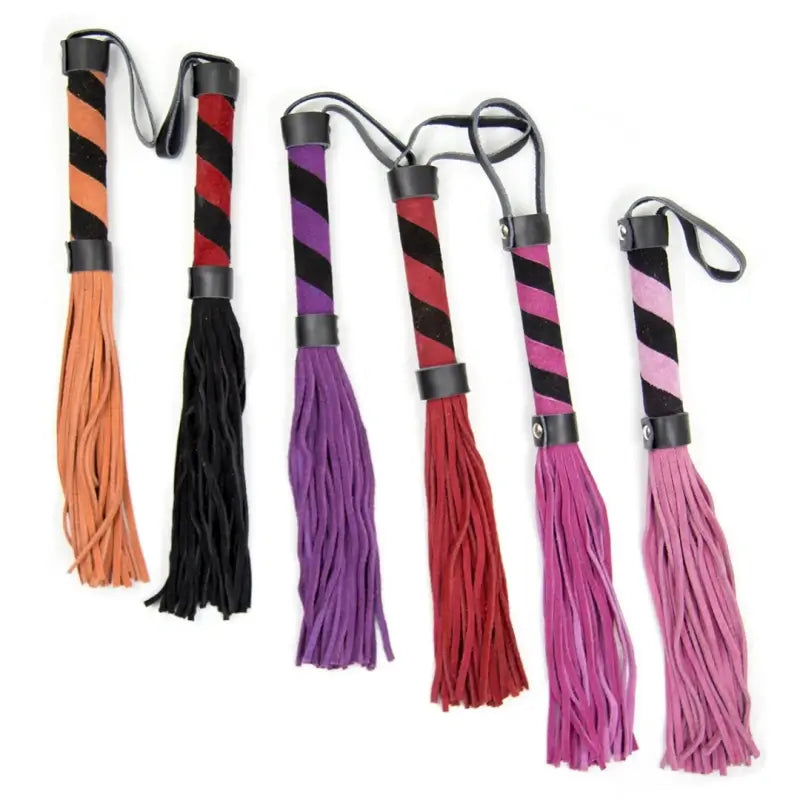 Mini suede flogger in black, red, pink and purple with striped suede handles